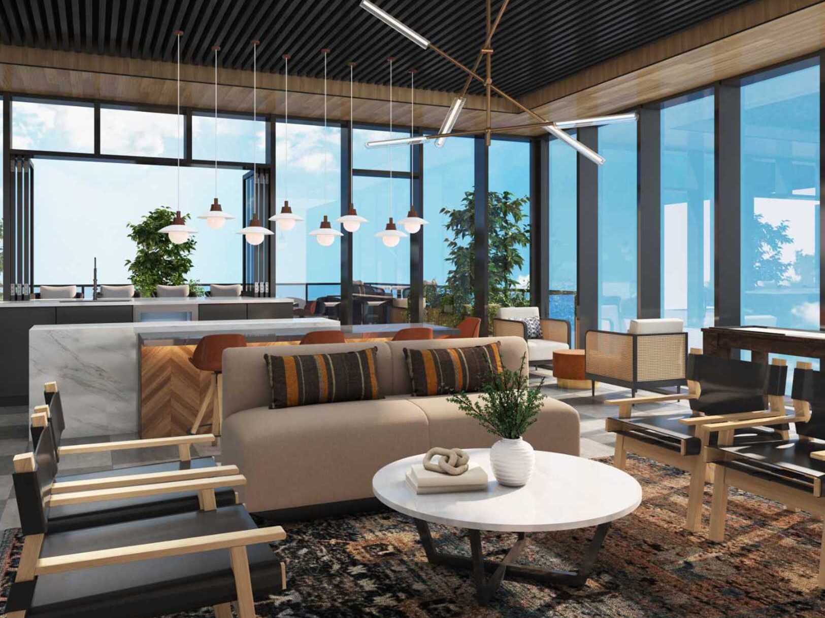 Modern lounge area with a sofa, chairs, coffee table, and large windows.